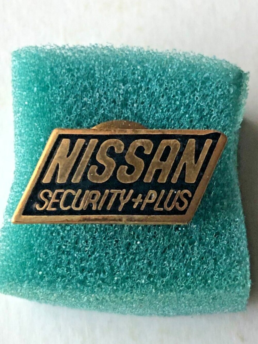 Nissan Security Plus Black Enamel Lapel Pin